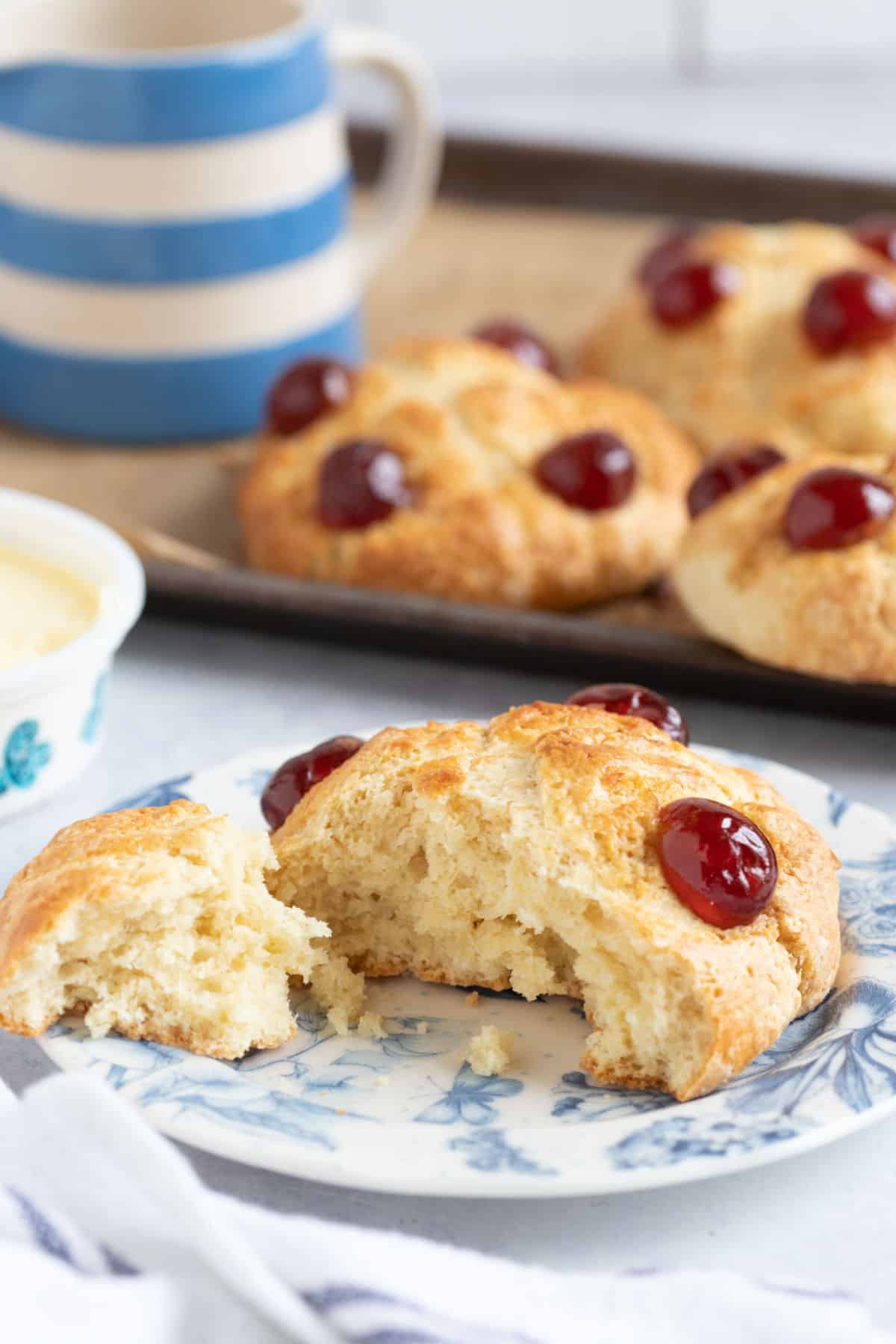 A Victoria scone split in half revealing the soft texture inside.