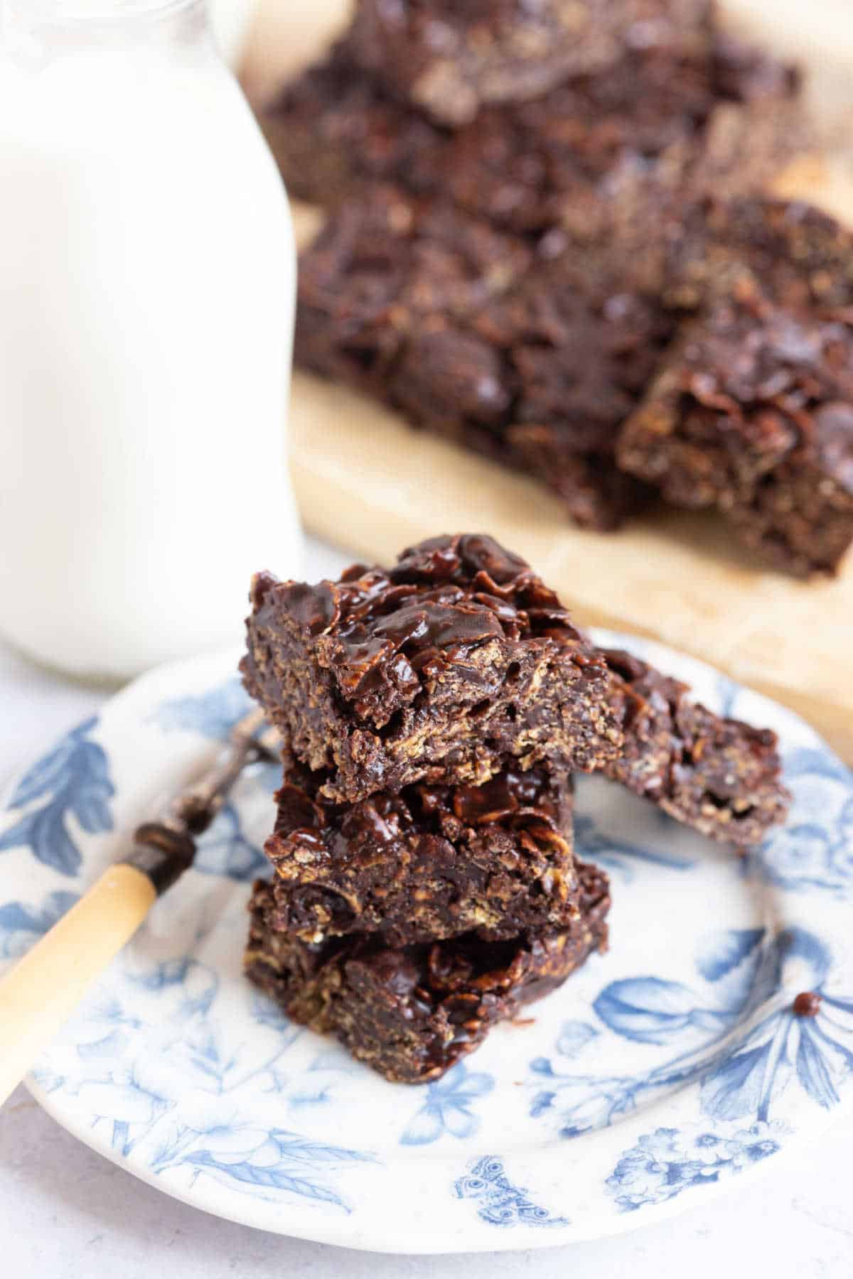 Chocolate cracknell bars on a blue and white plate.