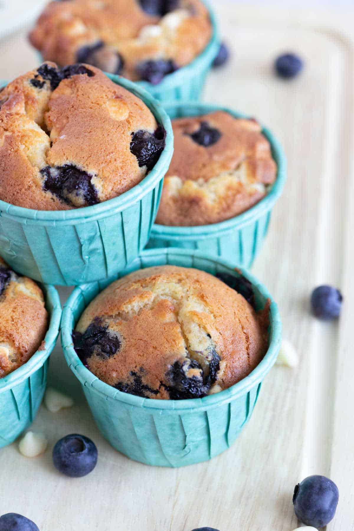 A stack of blueberry and white chocolate muffins.