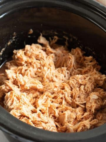BBQ pulled chicken in a slow cooker.