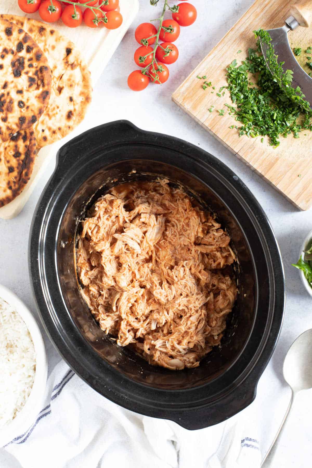 BBQ pulled chicken in a slow cooker.