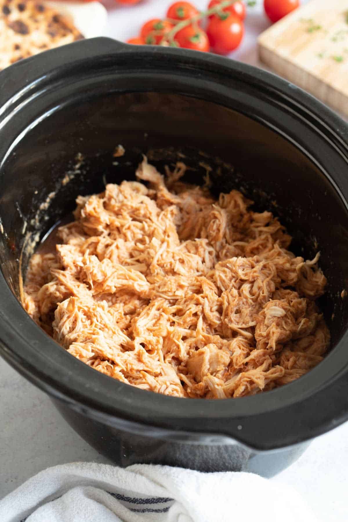 Slow cooker BBQ pulled chicken in a crockpot.