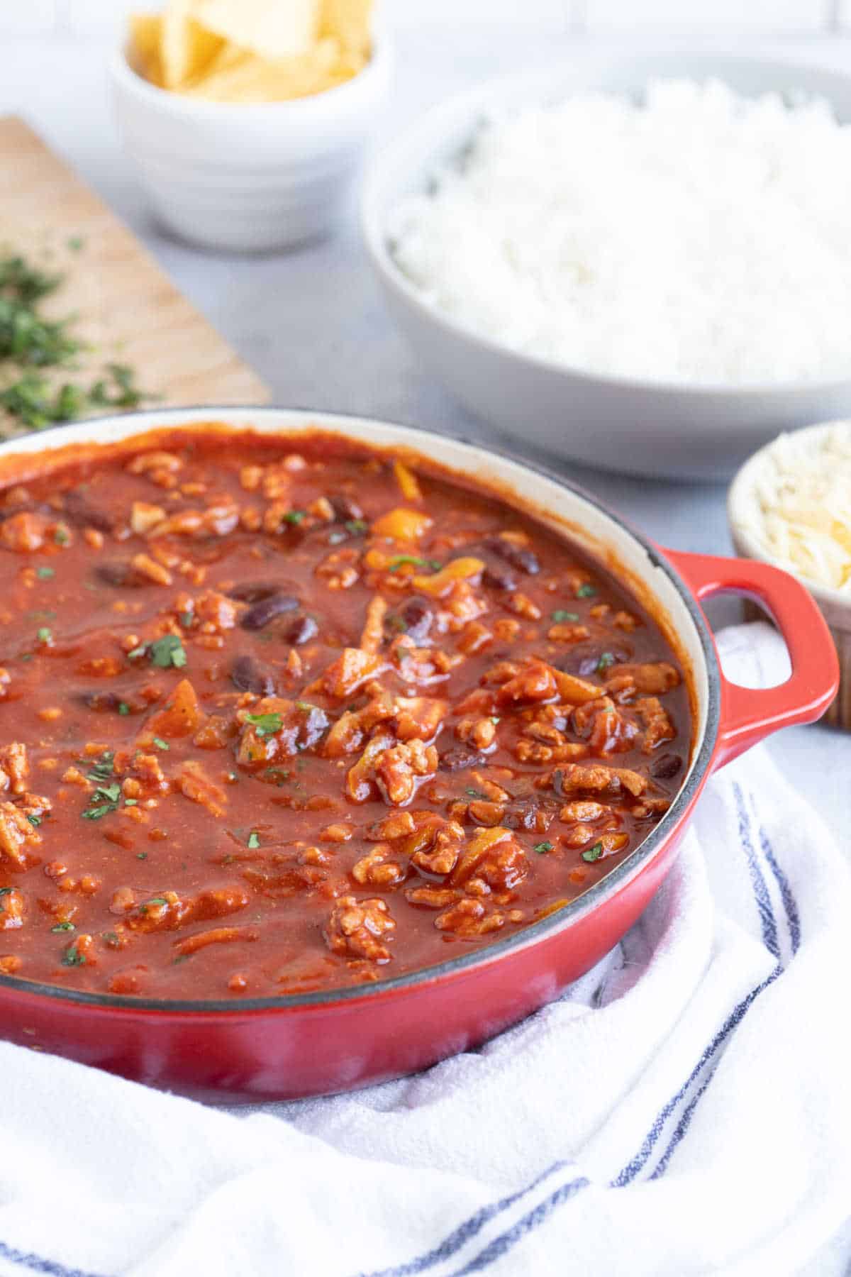 Rich and smoky turkey mince chilli in a red bowl.