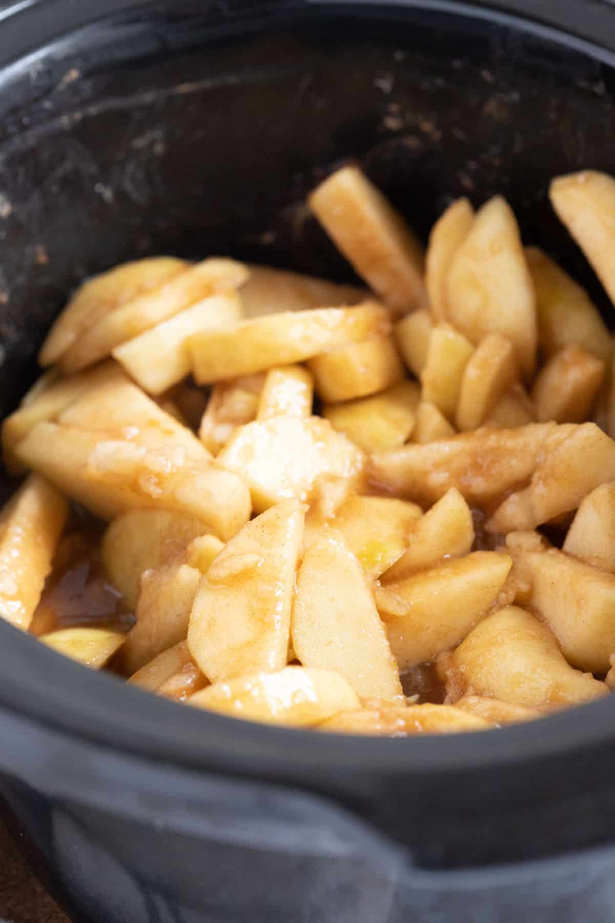 Chopped Bramley apples in a slow cooker.