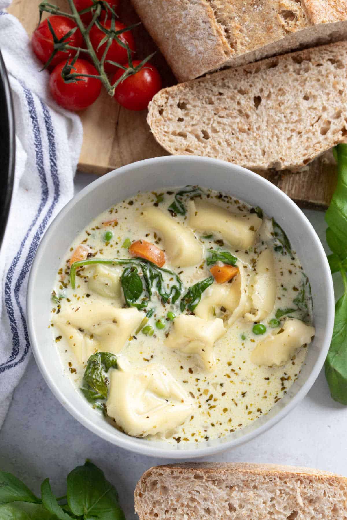 A bowl of slow cooker tortellini soup.