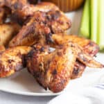 Crispy air fried chicken wings on a plate.