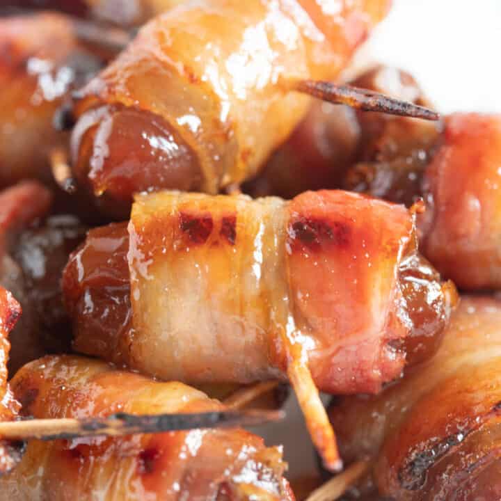 Air fried devils on horseback piled onto a plate.