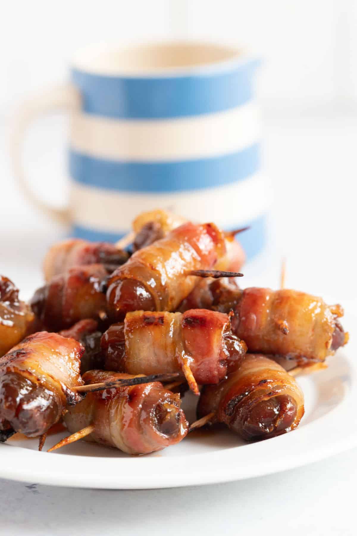 A plate of devils on horseback with a maple sriracha glaze.