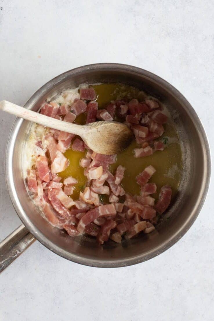 Bacon frying in butter.