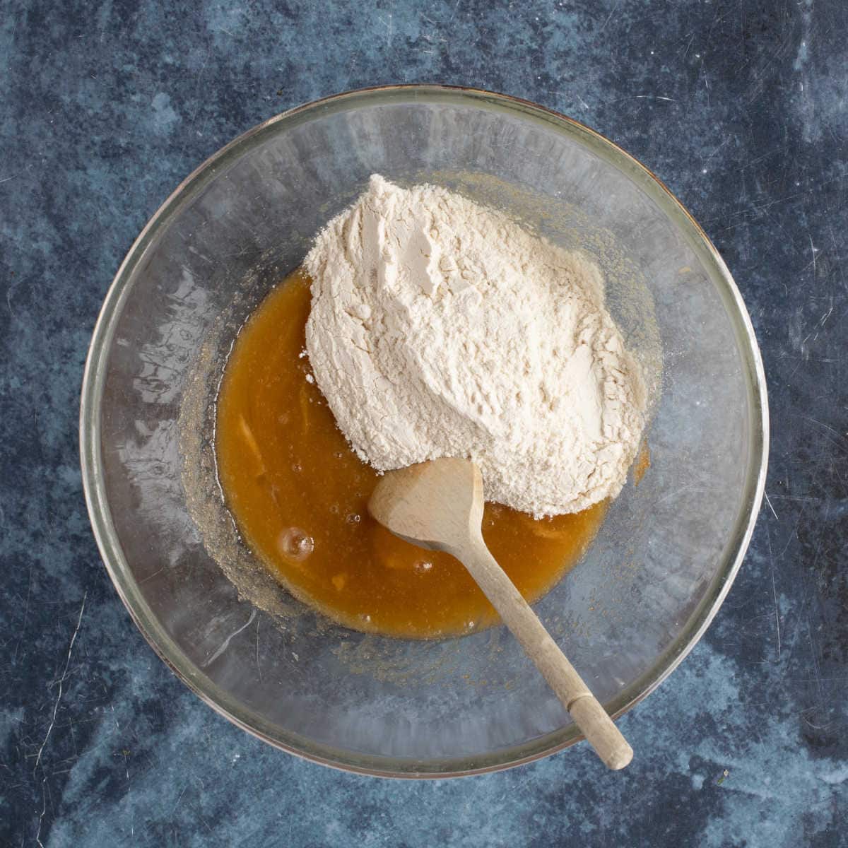 Adding flour to the blondie batter.