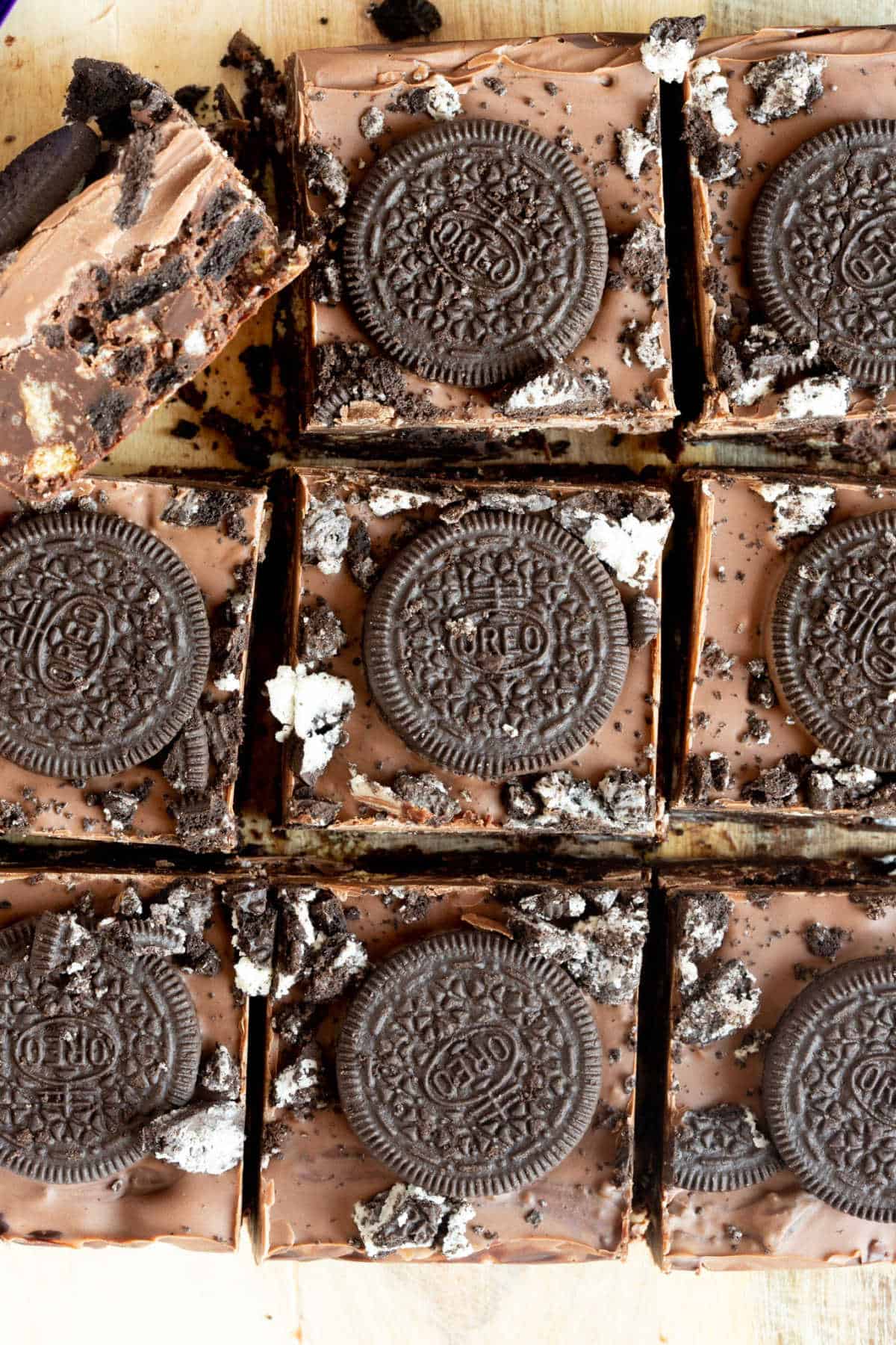 Oreo tiffin bars on a wooden board.