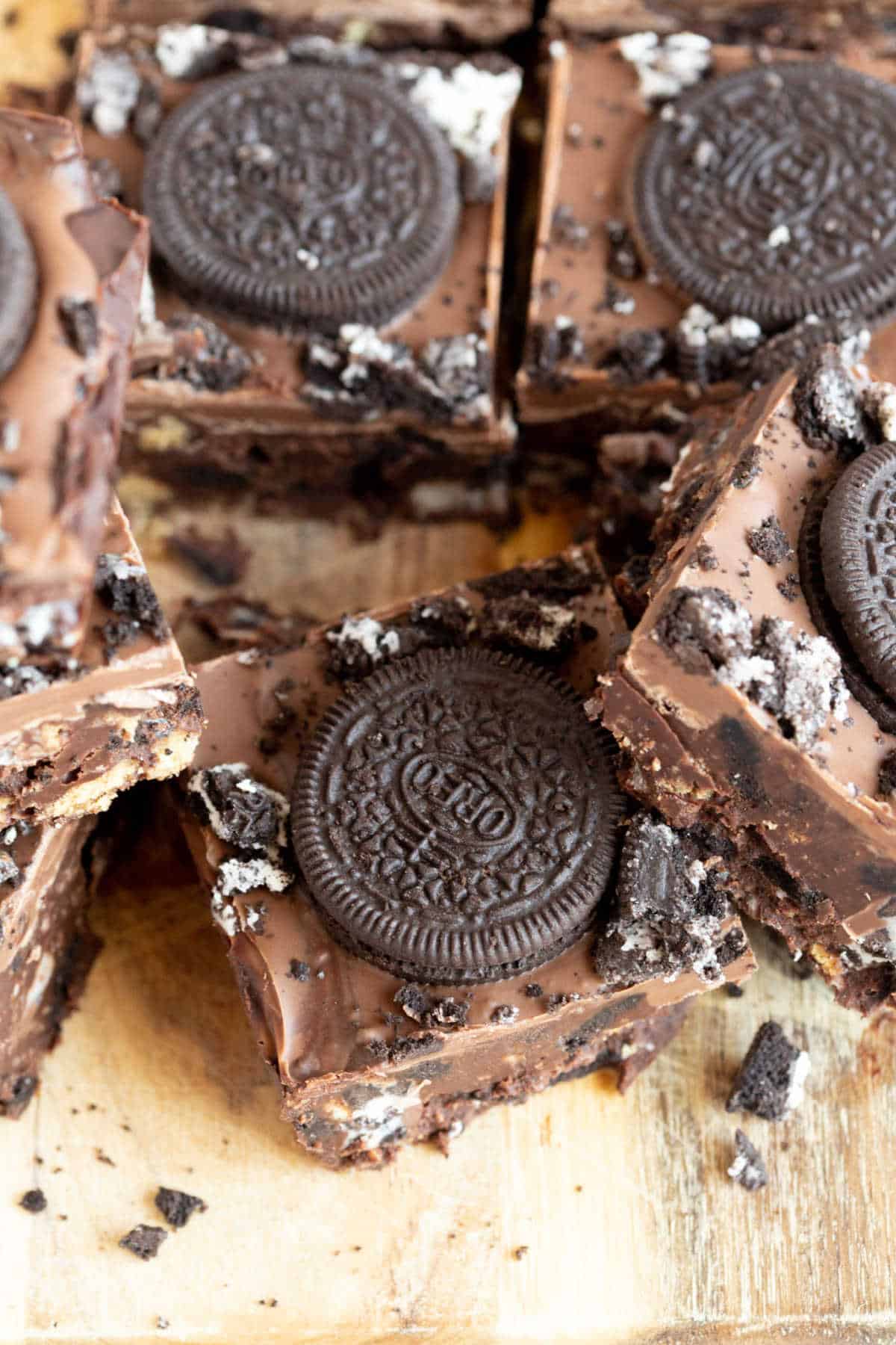 Oreo tiffin bars on a wooden board.