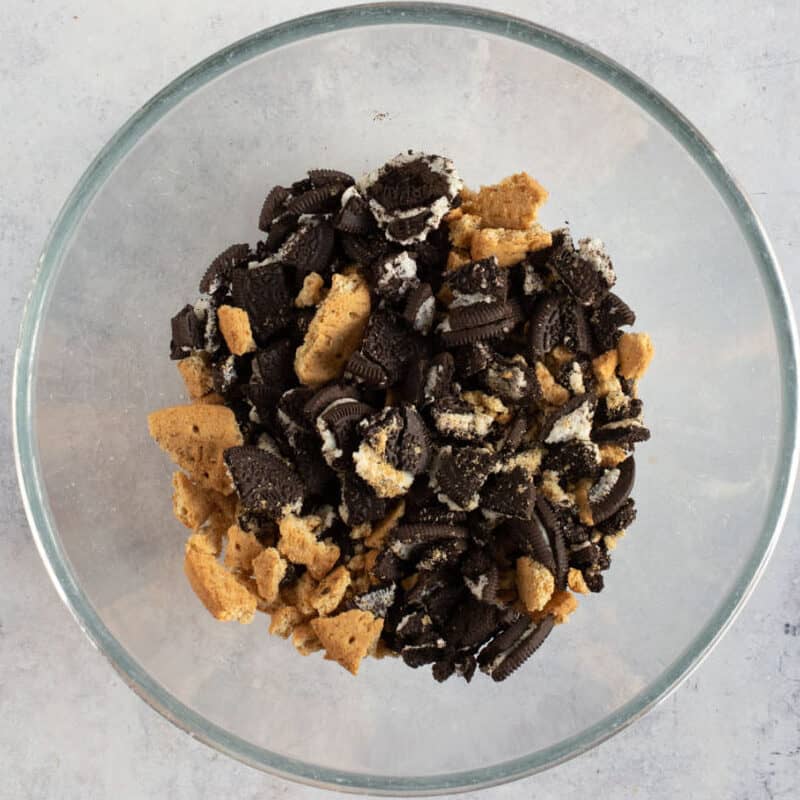 Crushed Oreo's and digestives in a bowl.