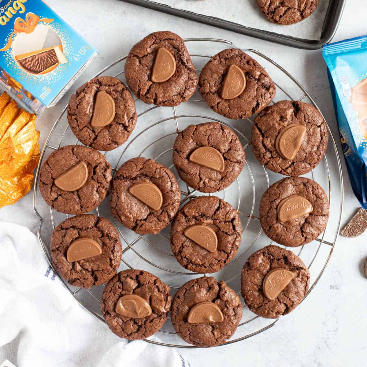 Chocolate orange cookies on a cooling rack.