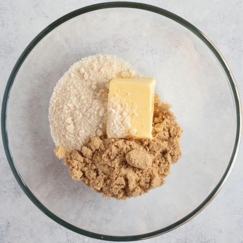 Butter and sugar in a mixing bowl.