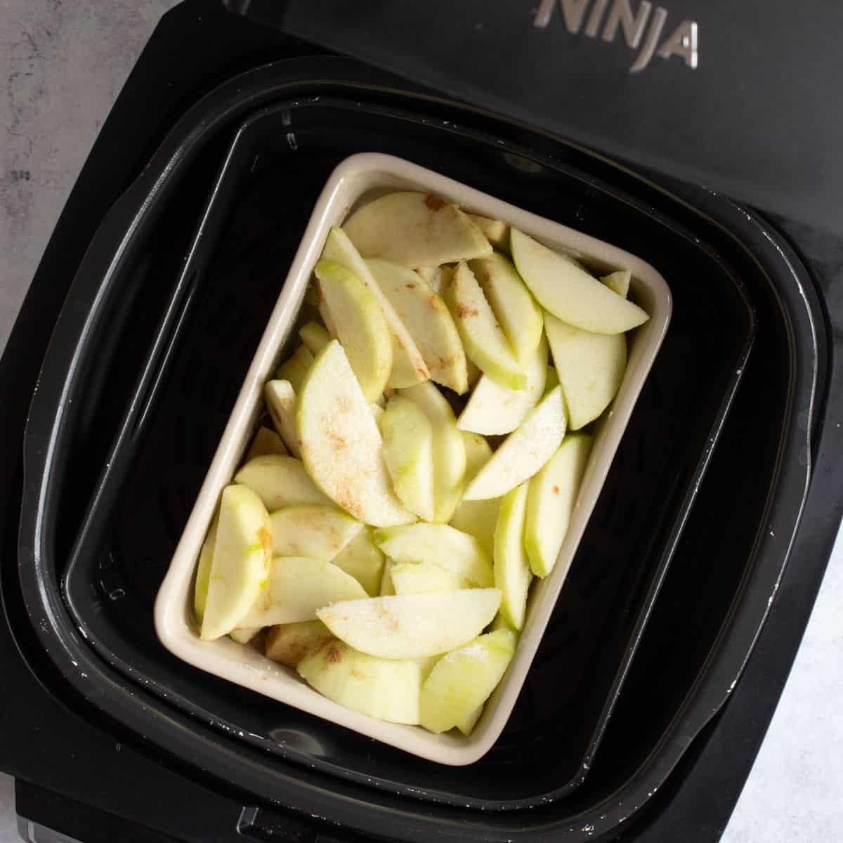 Sliced apples in air fryer.