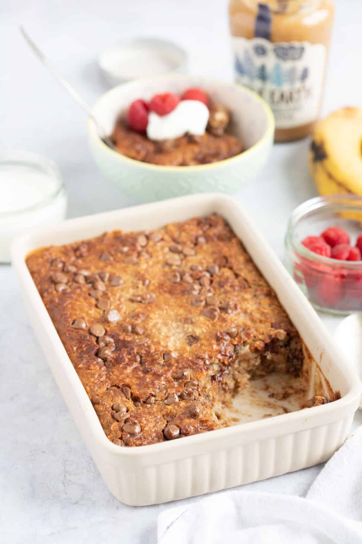Banana, peanut butter and chocolate chip air fryer baked oats in a rectangular dish.