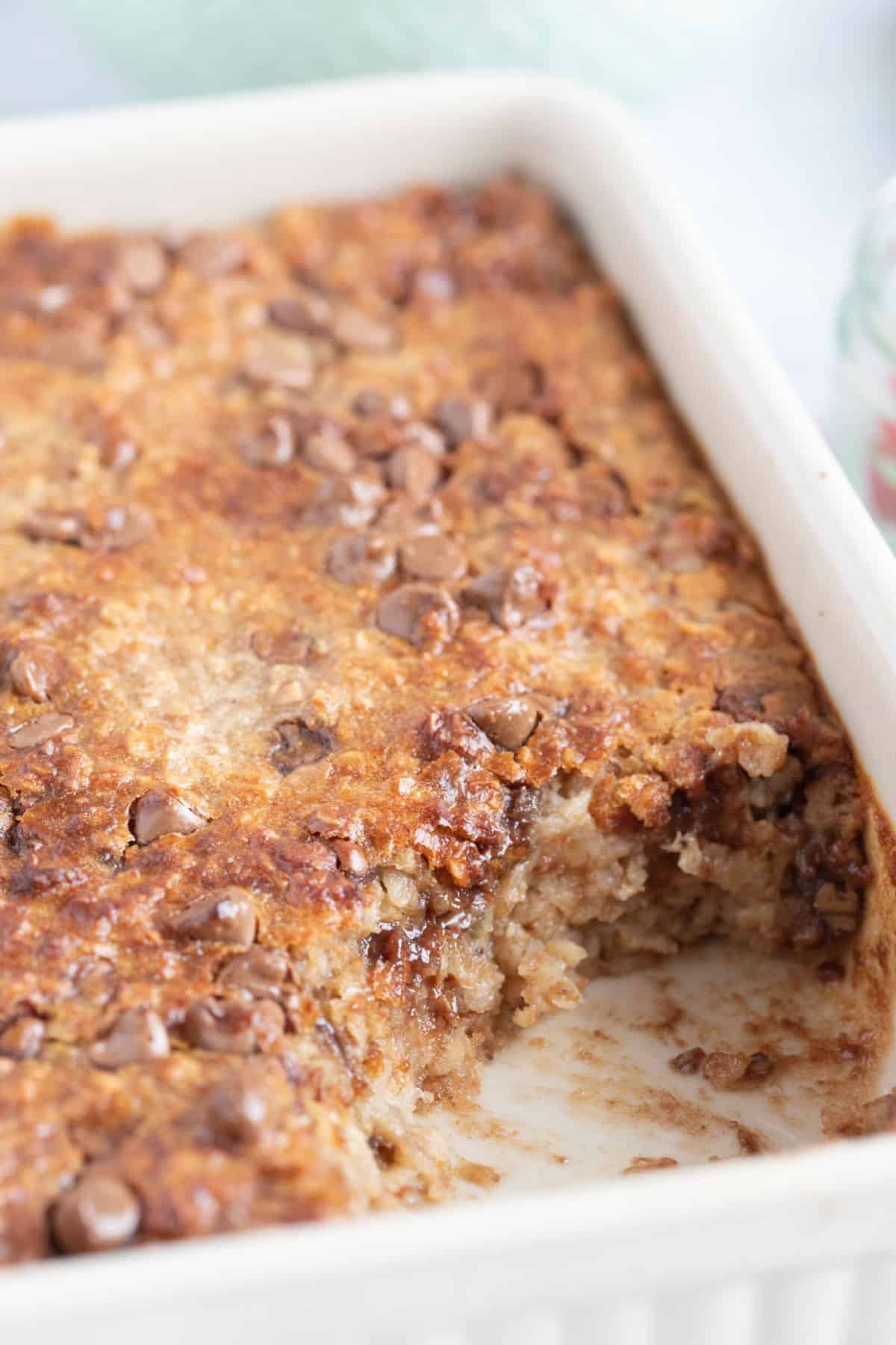 Air fryer baked oats with banana and peanut butter in a baking dish.