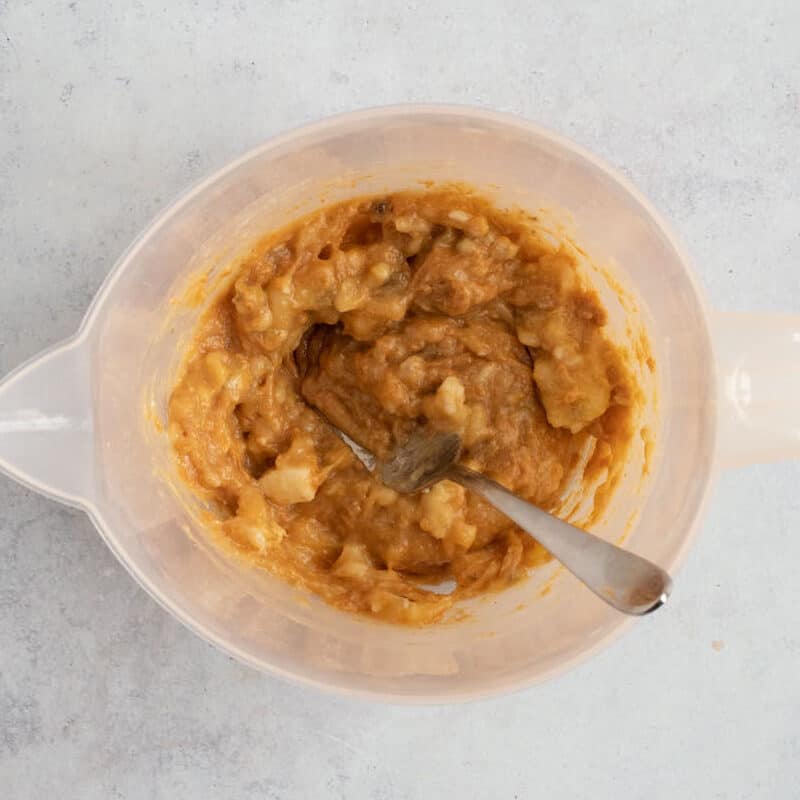 Mashed banana and peanut butter in a jug.