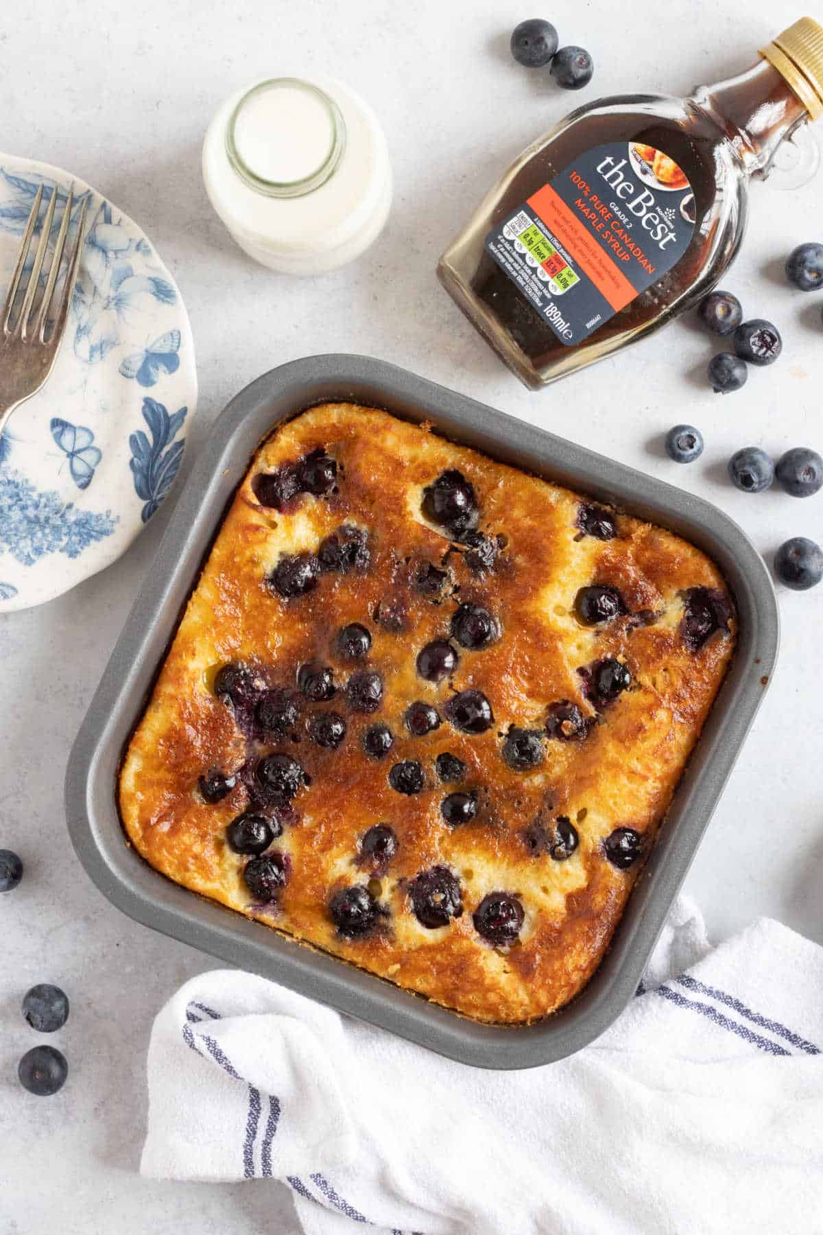 Air fryer blueberry pancakes in a baking tin.