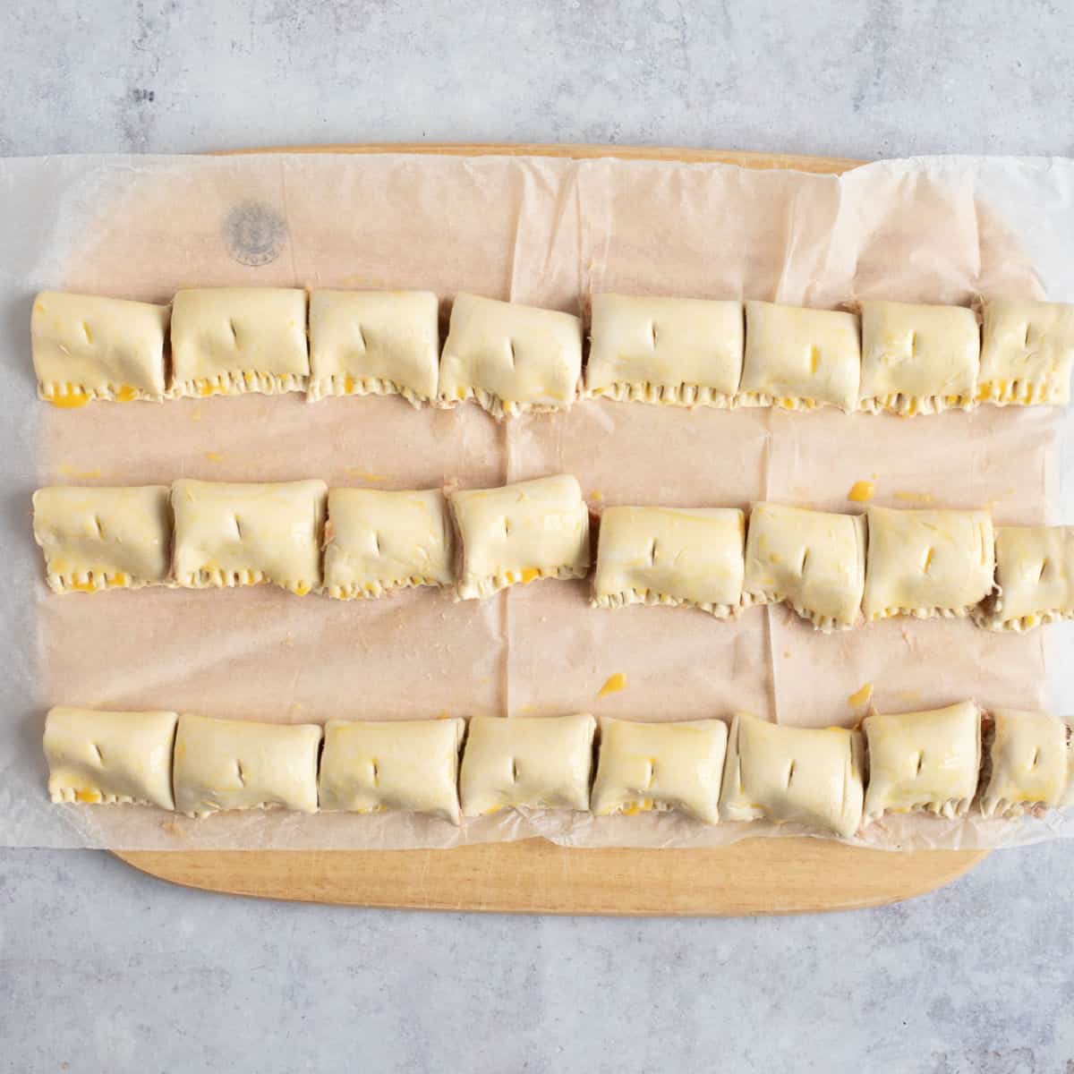 Cut sausage rolls ready for baking.