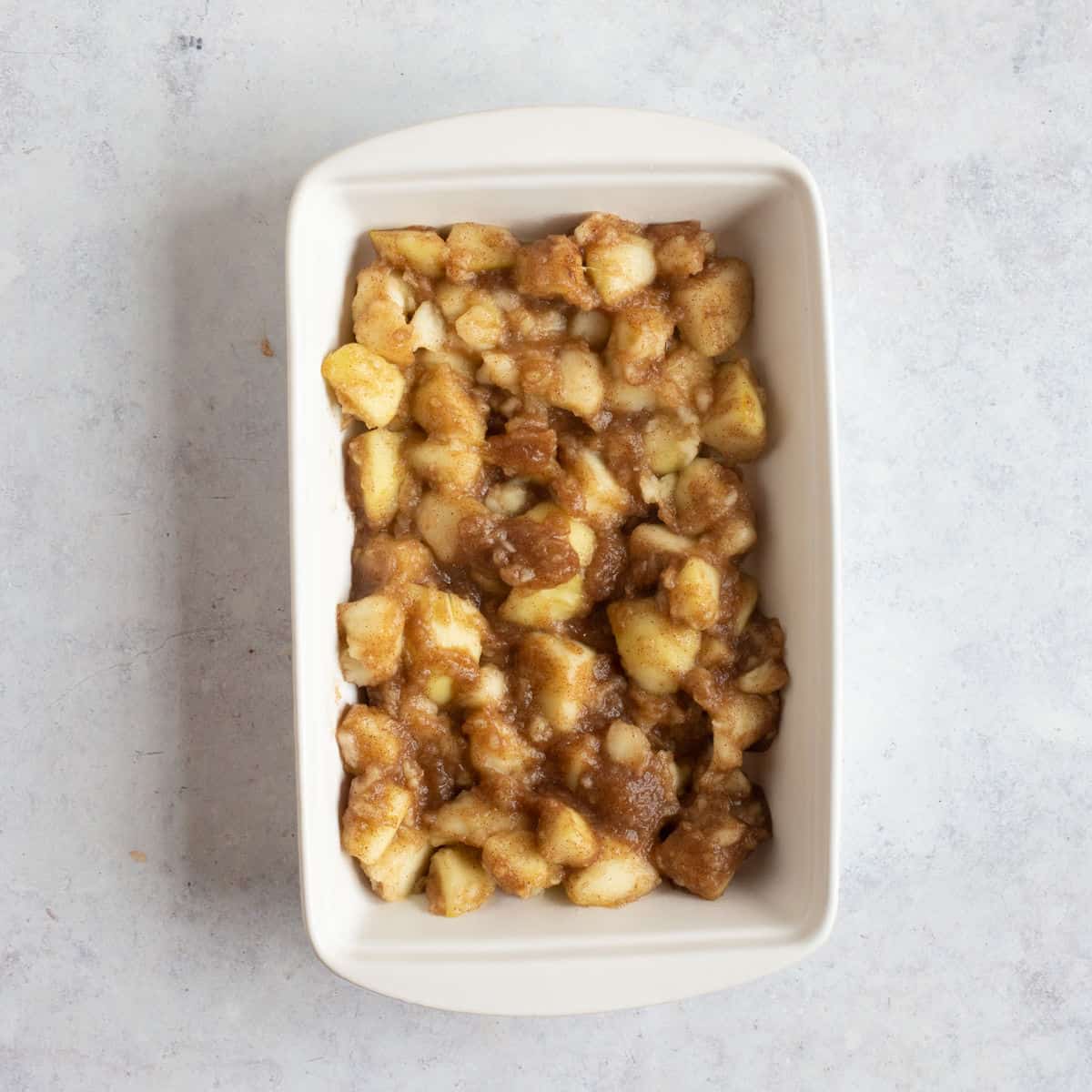 Stewed apples in a baking dish.