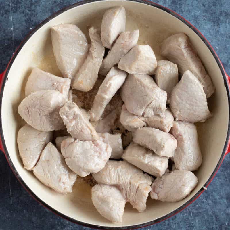 Diced pork in a pan.