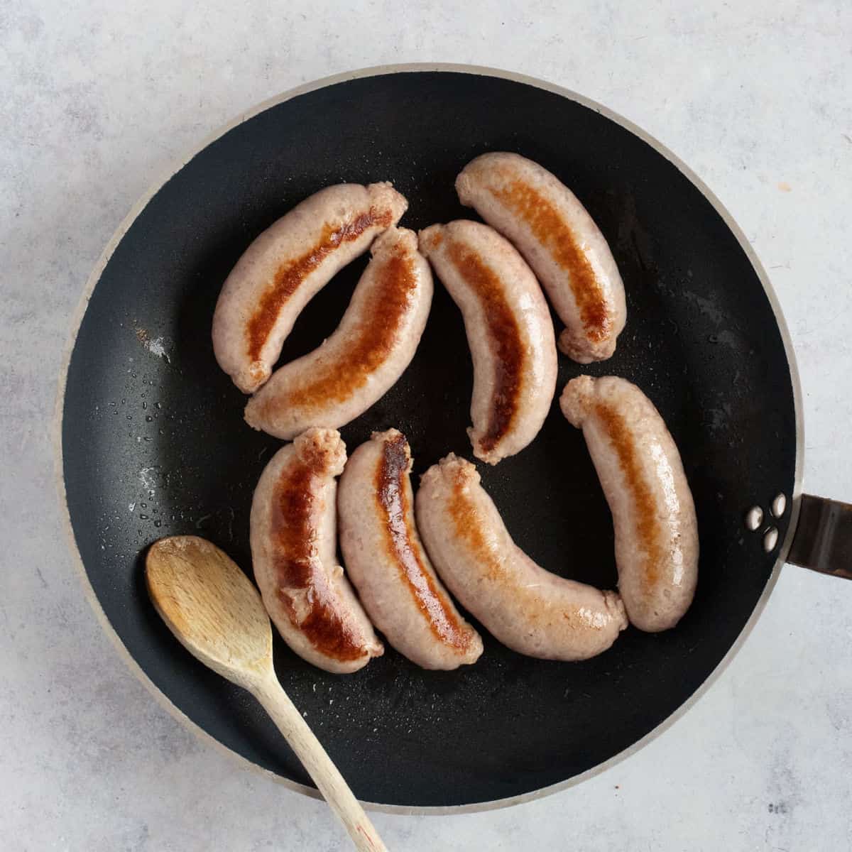 Sausages in a pan.