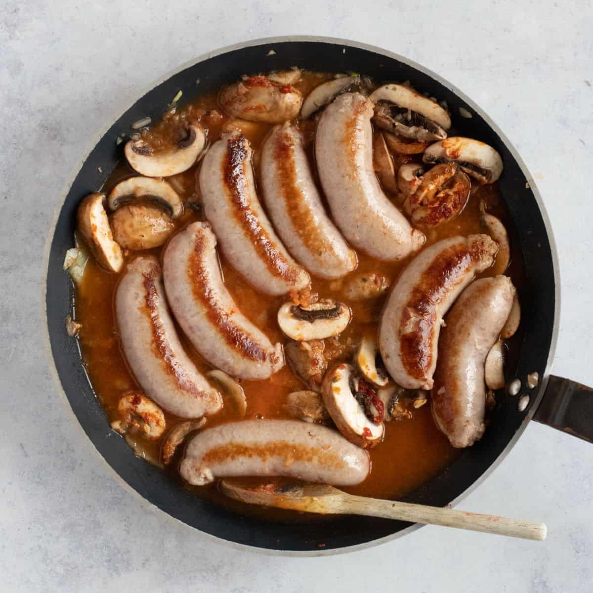 Sausage stroganoff in a pan.