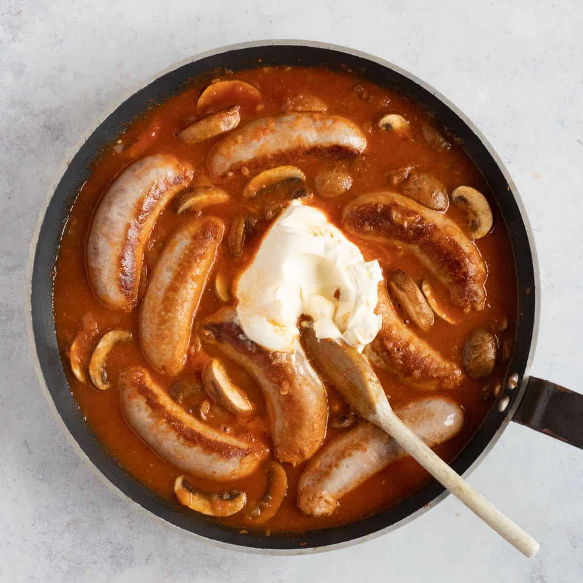 A dollop of creme fraiche in a sausage stroganoff.