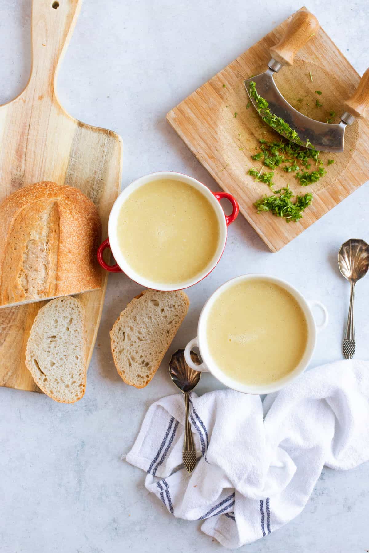 Soup maker leek and potato soup in bowls with crusty bread.