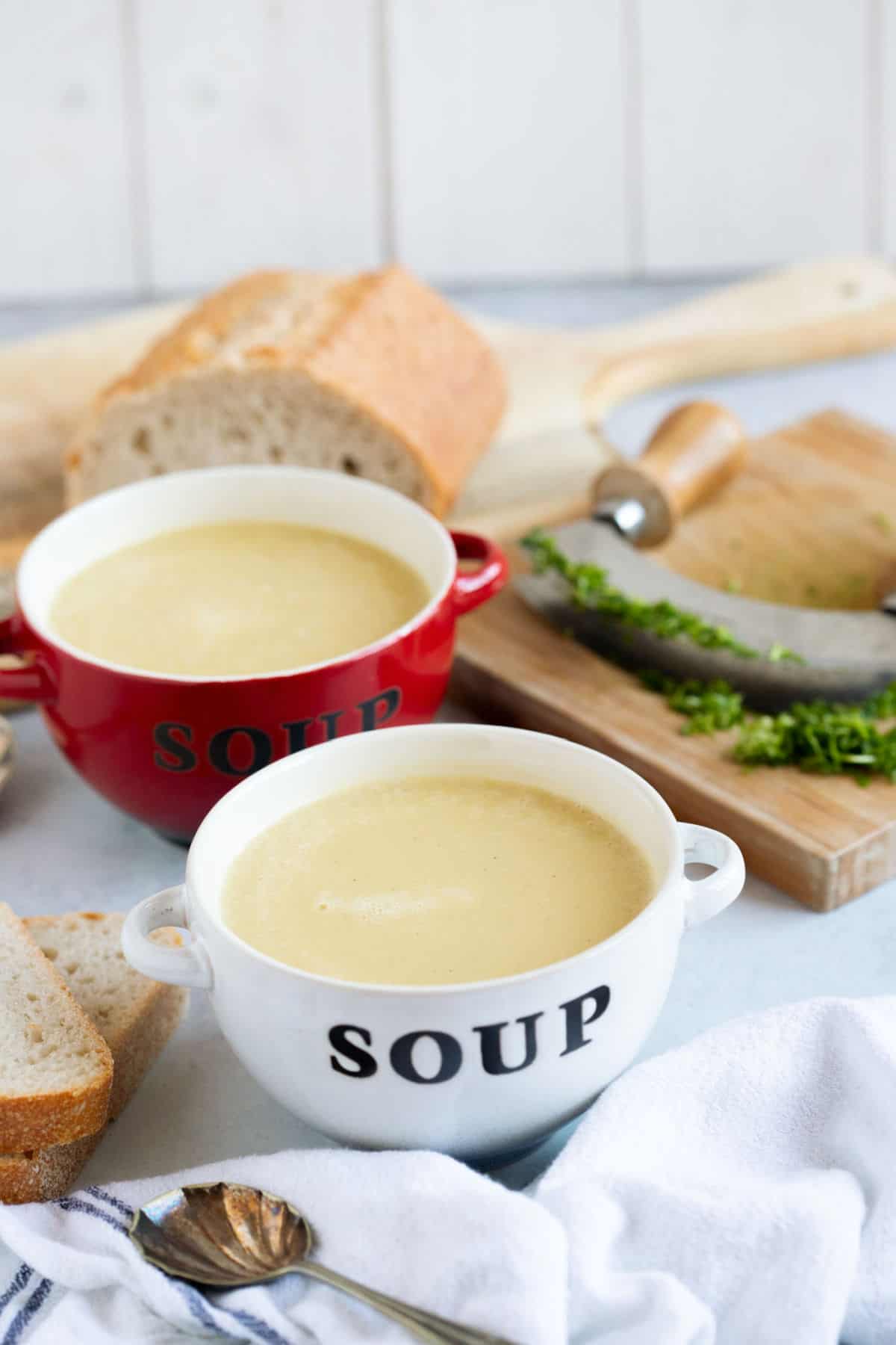 Two bowls of leek and potato soup.