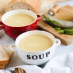 Two bowls of leek and potato soup made in a soup maker.