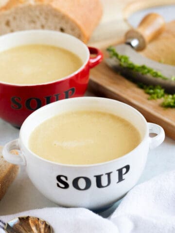 Two bowls of leek and potato soup made in a soup maker.