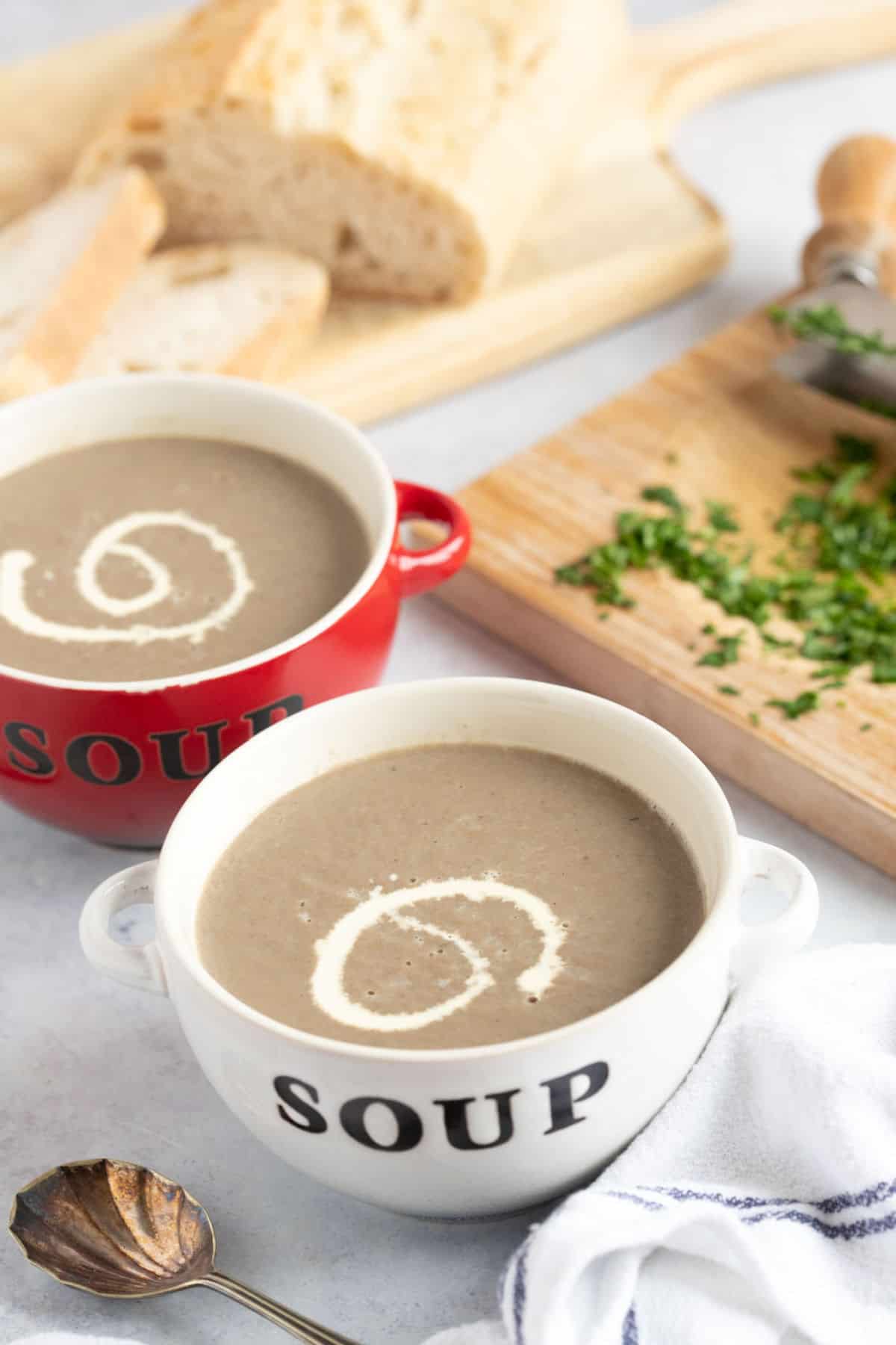 Two bowls of creamy mushroom soup.