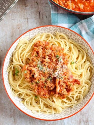 A bowl of pork mince bolognese with spaghetti.