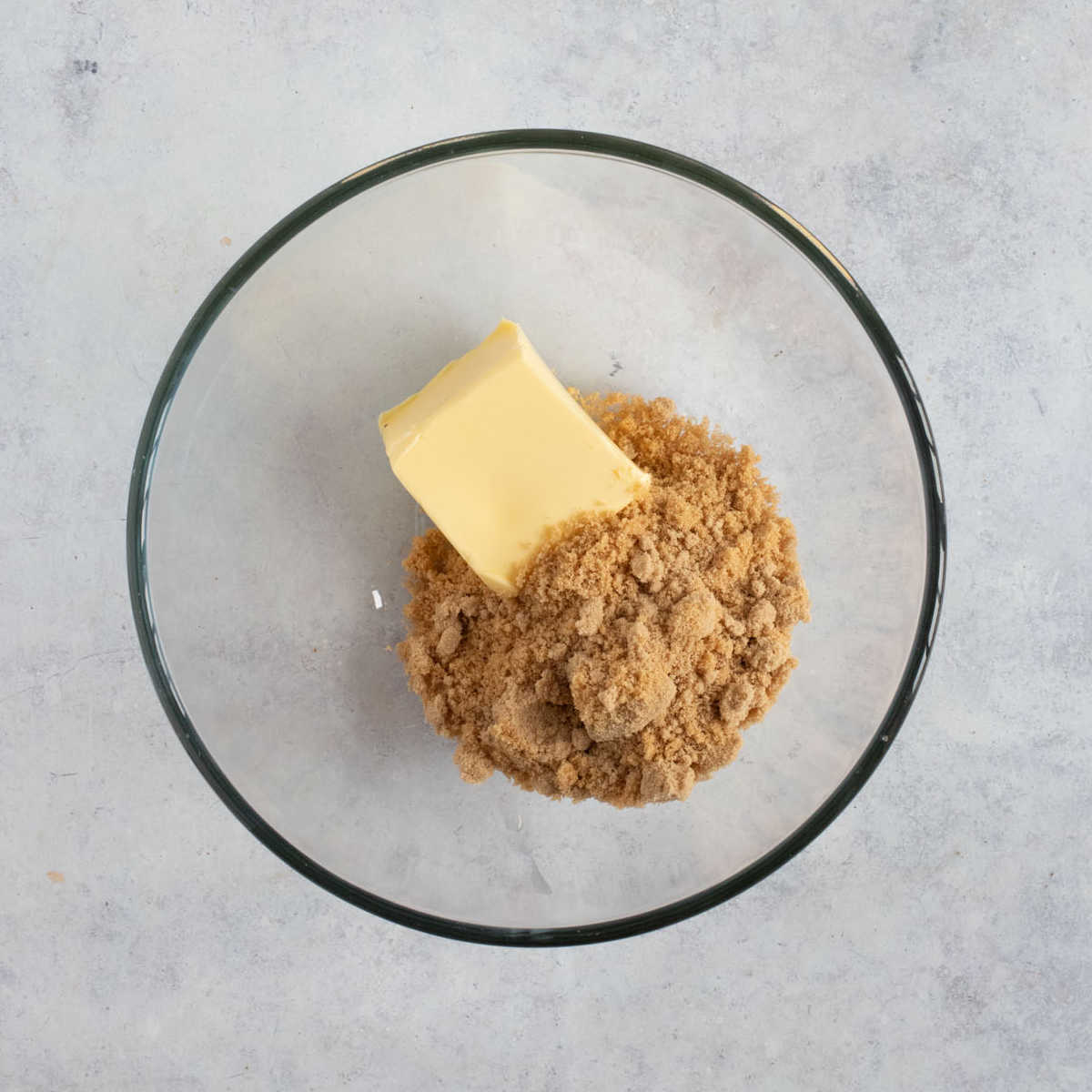 Butter and sugar in a bowl.