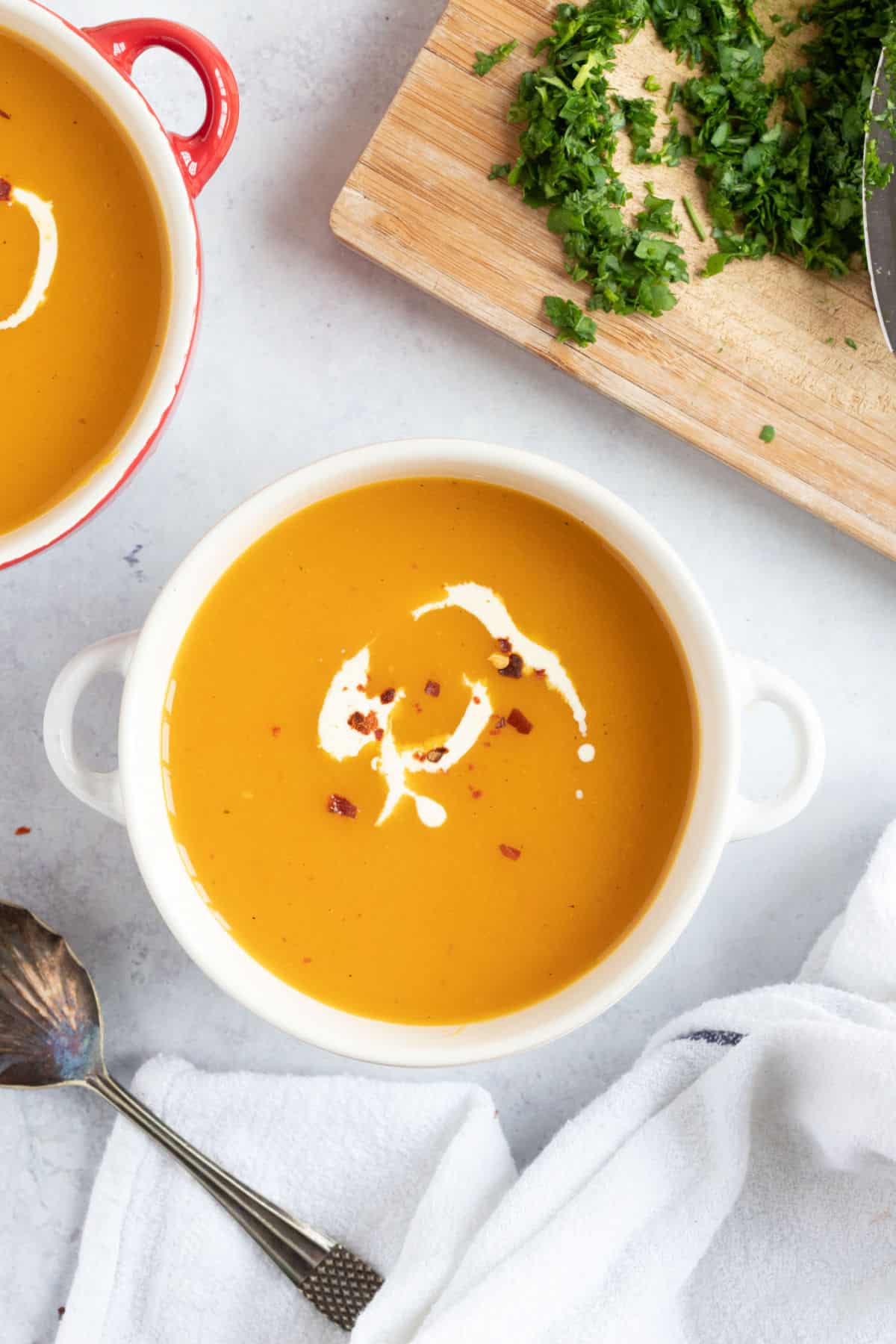 A bowl of butternut squash and sweet potato soup.