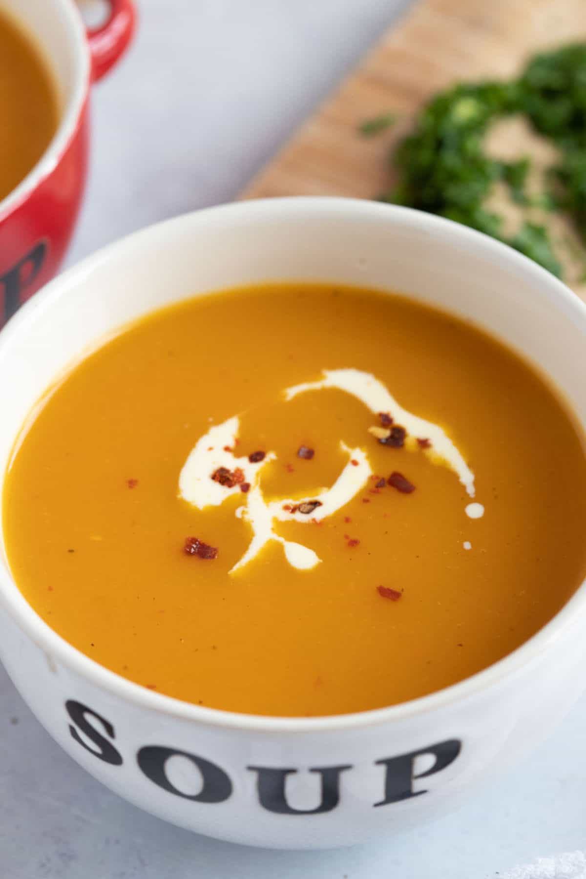 A bowl of sweet potato and butternut squash soup.