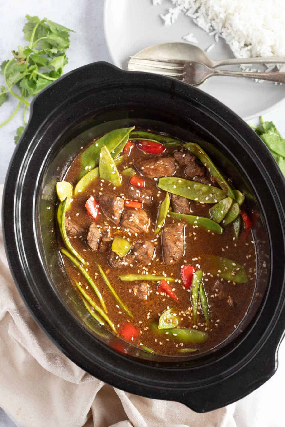 Slow cooker chinese beef with red peppers and mange tout.