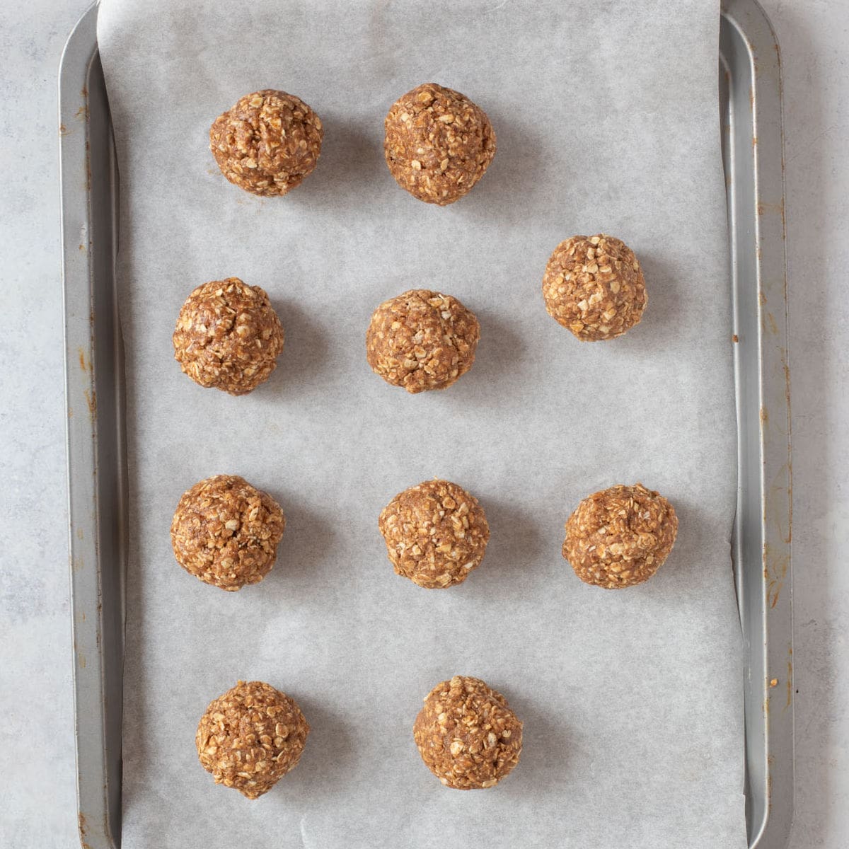 Rolled protein balls on a lined baking tray