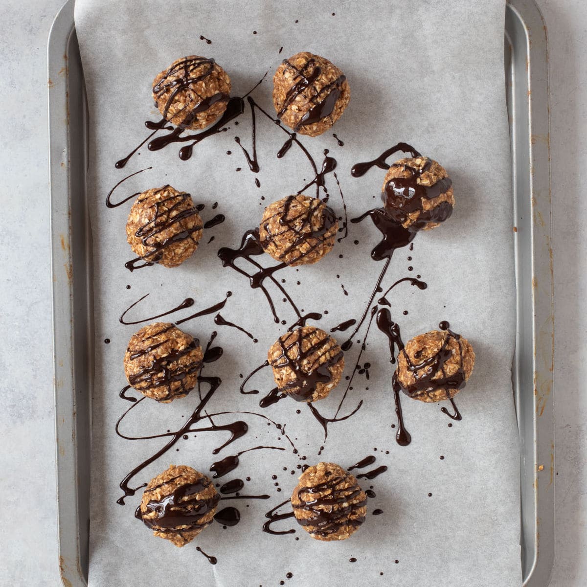 Dark chocolate drizzled over protein balls