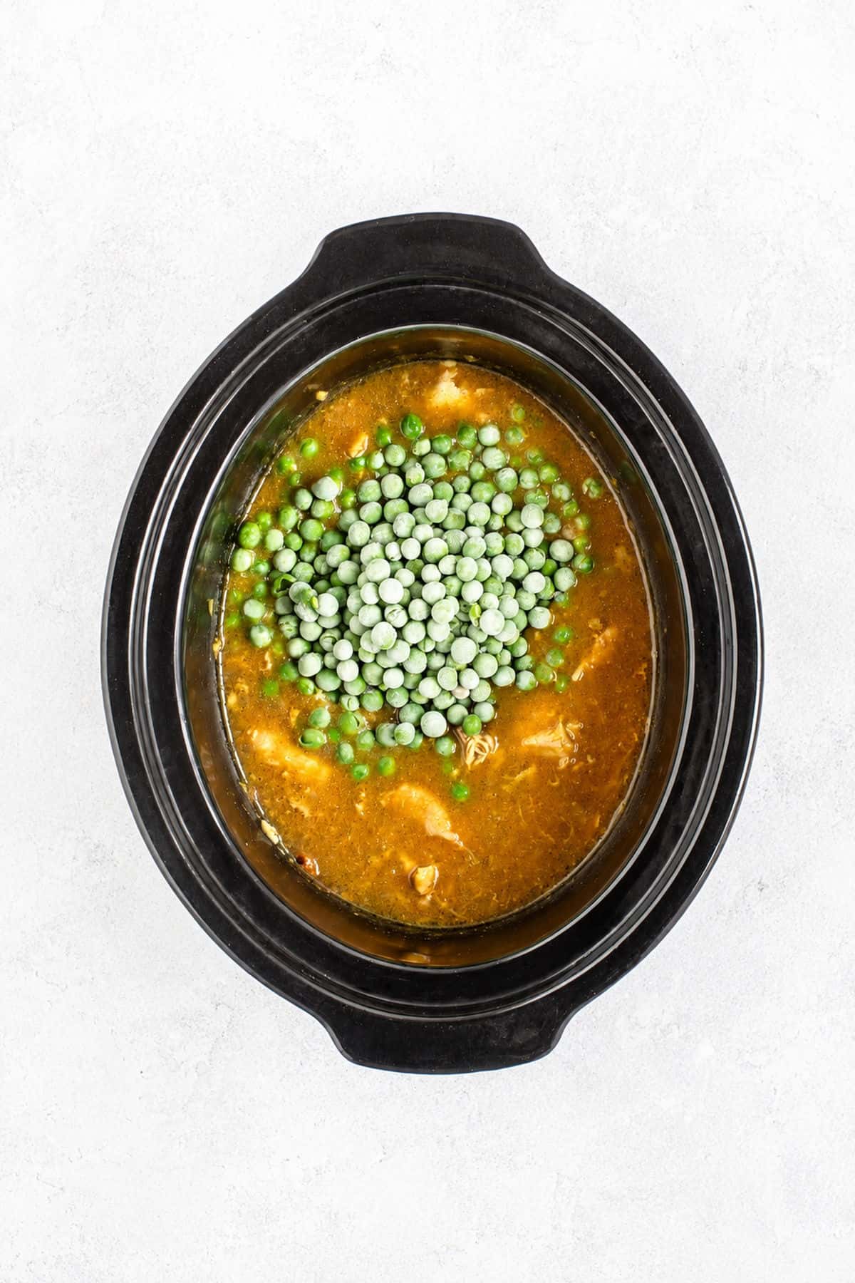 Peas added to the Chinese slow cooker chicken curry.